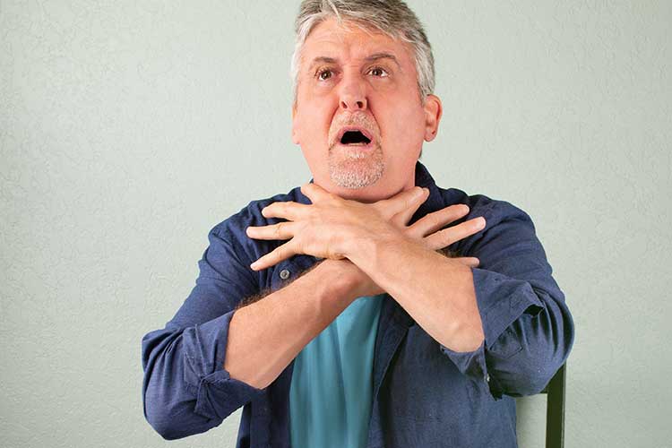 picture of an elderly man chocking